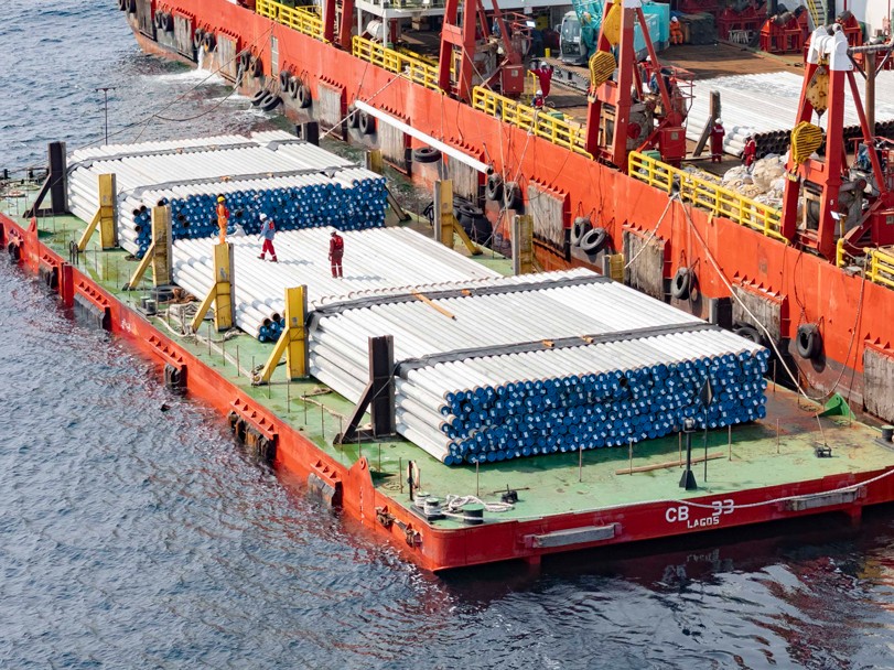 Pipe materials staged for offshore installation